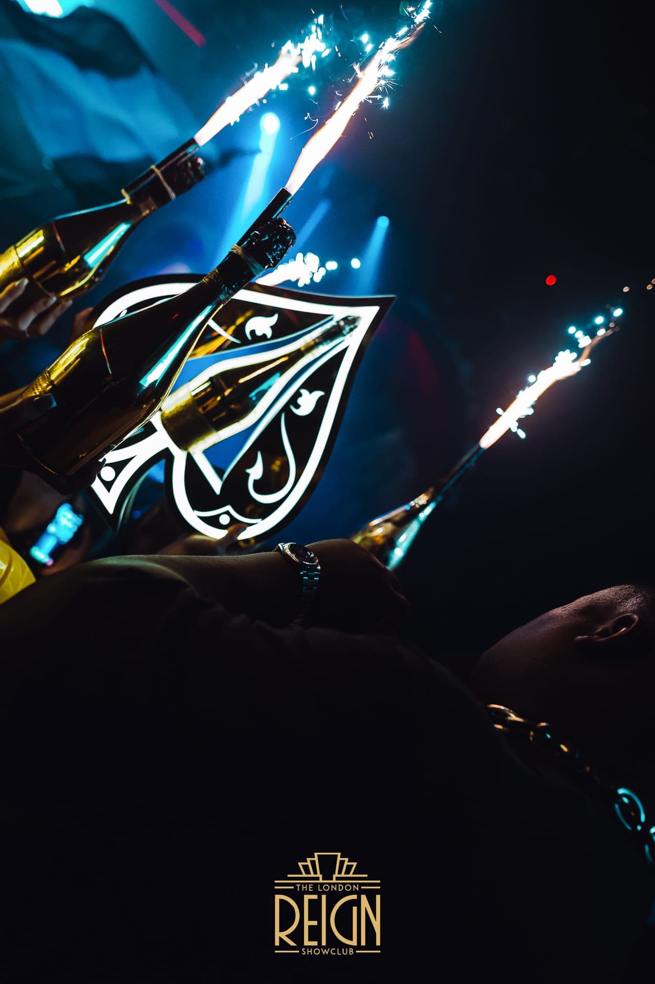 VIP table service at a premium London nightclub with champagne and bottle sparklers
