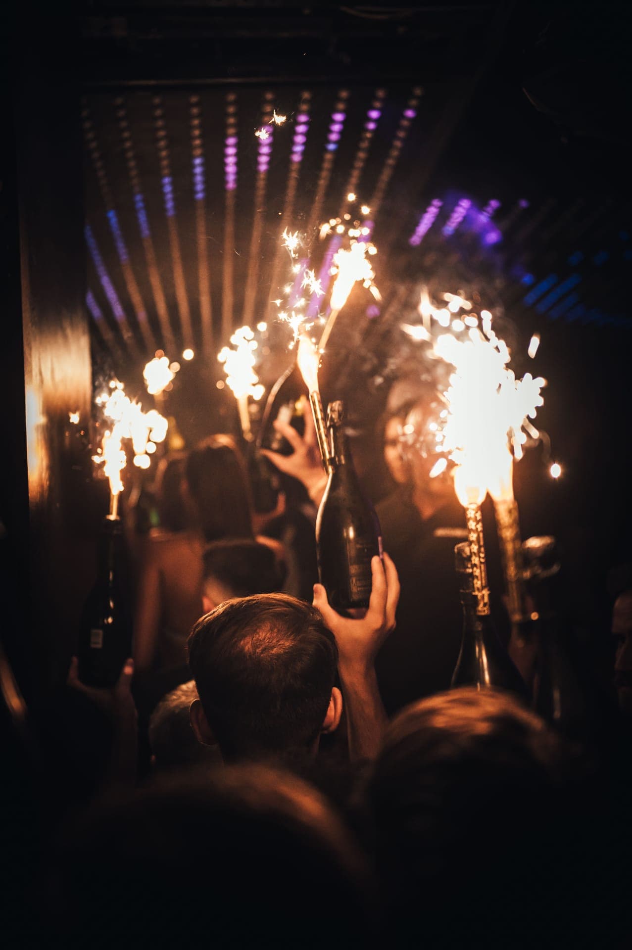 Large group enjoying VIP table service at a London club
