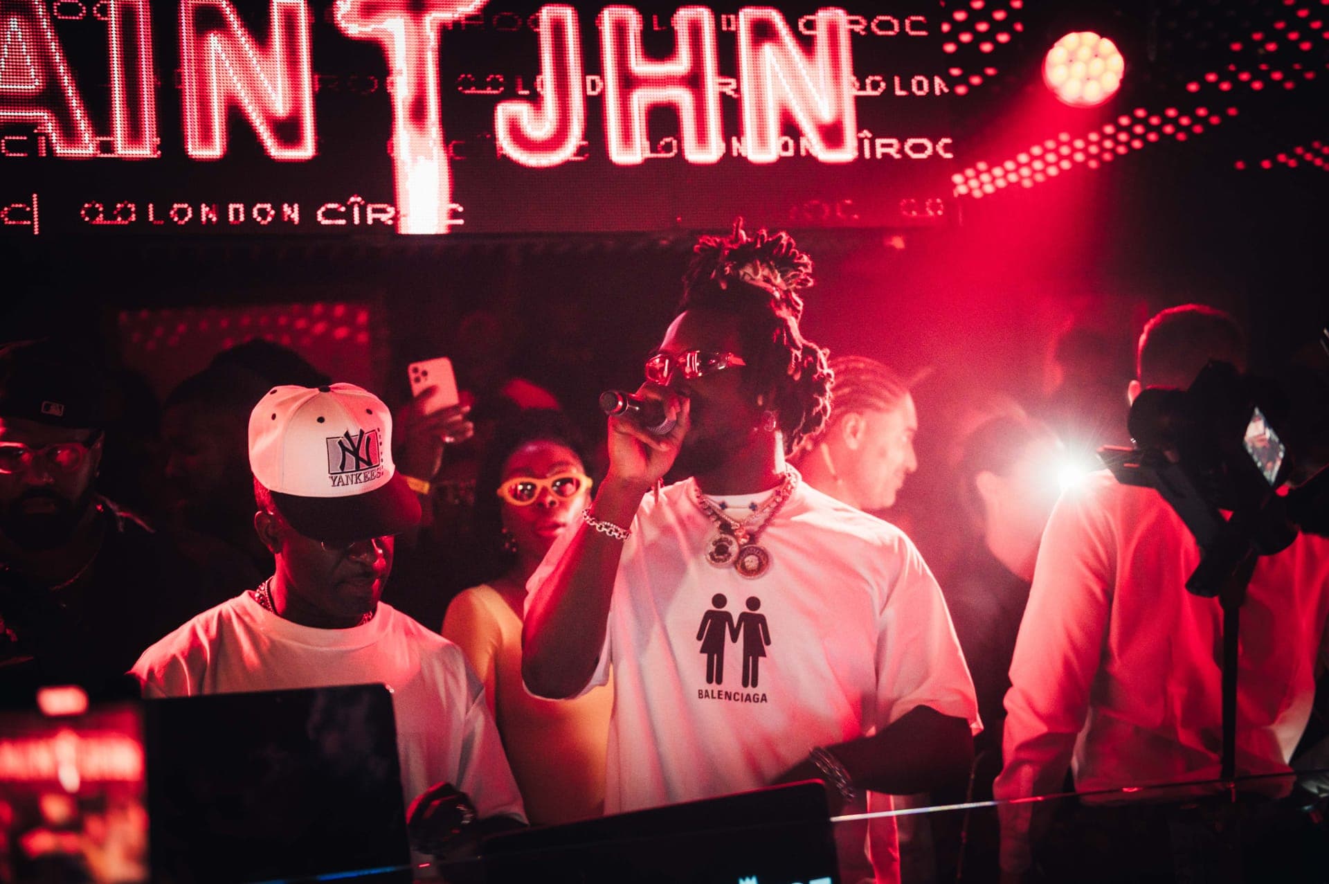 Interior of a luxury London nightclub with ambient lighting and VIP tables