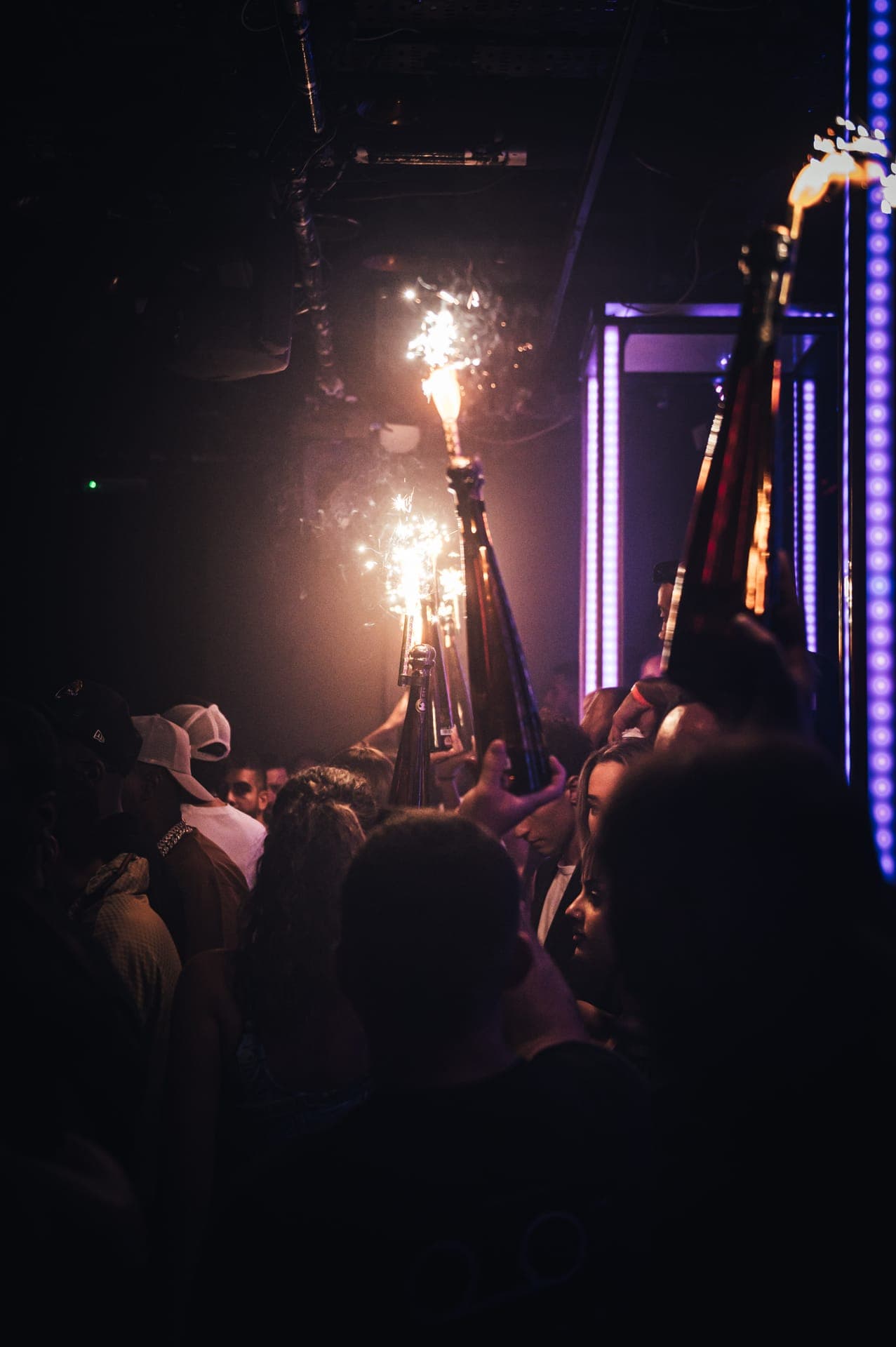 VIP table service at a premium London nightclub with champagne and bottle sparklers